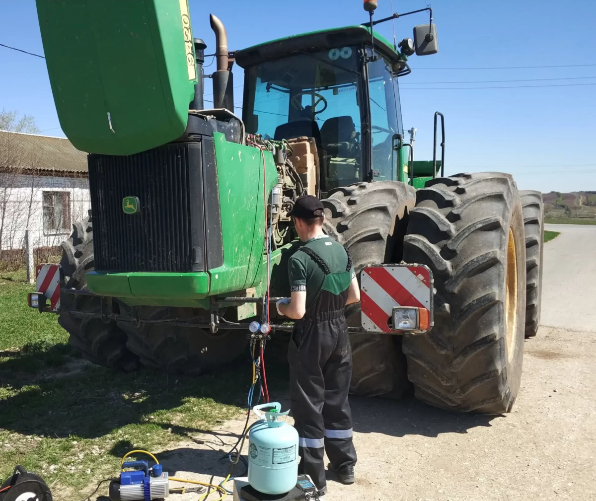 Refilling the John Deree tractor air conditioner